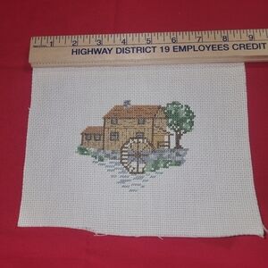 Cross-stitch handmade water building scene.  Just needs a frame.